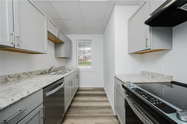 a white toilet sitting next to a window