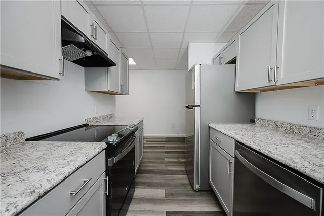 an empty room with wooden floor