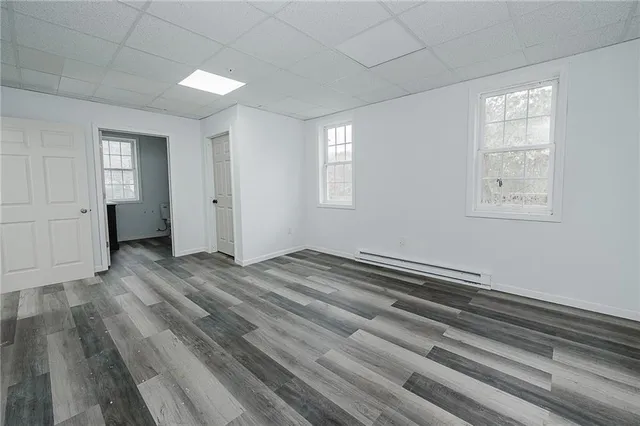 a view of a kitchen with a sink and dishwasher cabinets