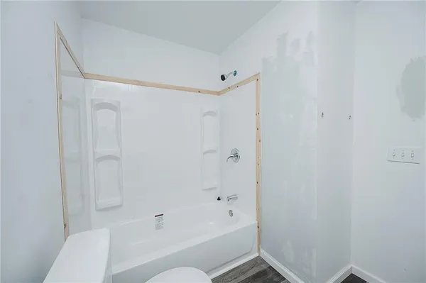 a kitchen that has a sink a refrigerator and a sink