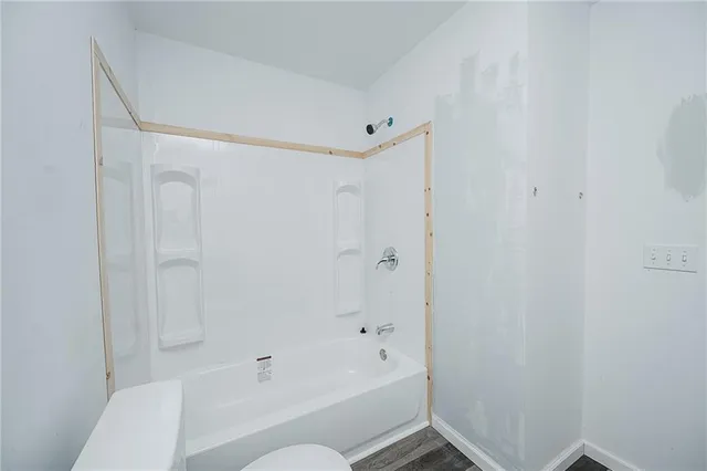 a kitchen that has a sink a refrigerator and a sink