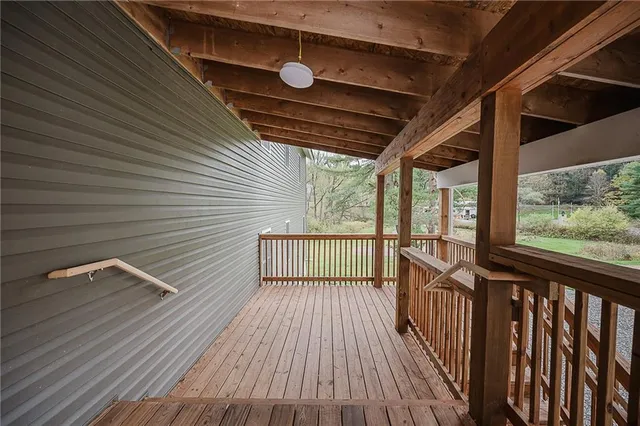 a kitchen with a white cabinets wooden floor and stainless steel appliances