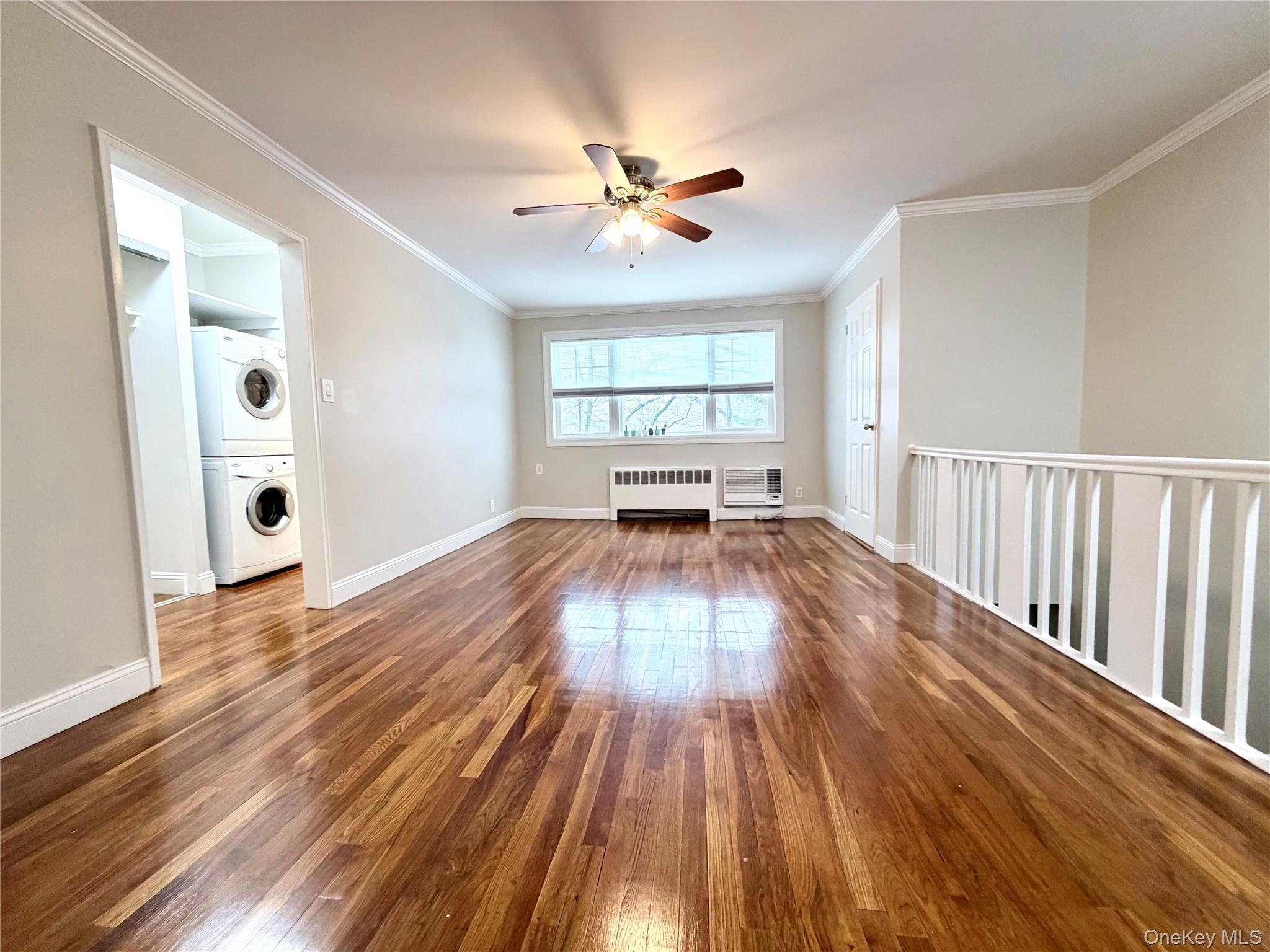 77-17 Springfield Boulevard, Unit 98 Queens, NY 11364 - Photo 3 of 18 a view of empty room with wooden floor and fan