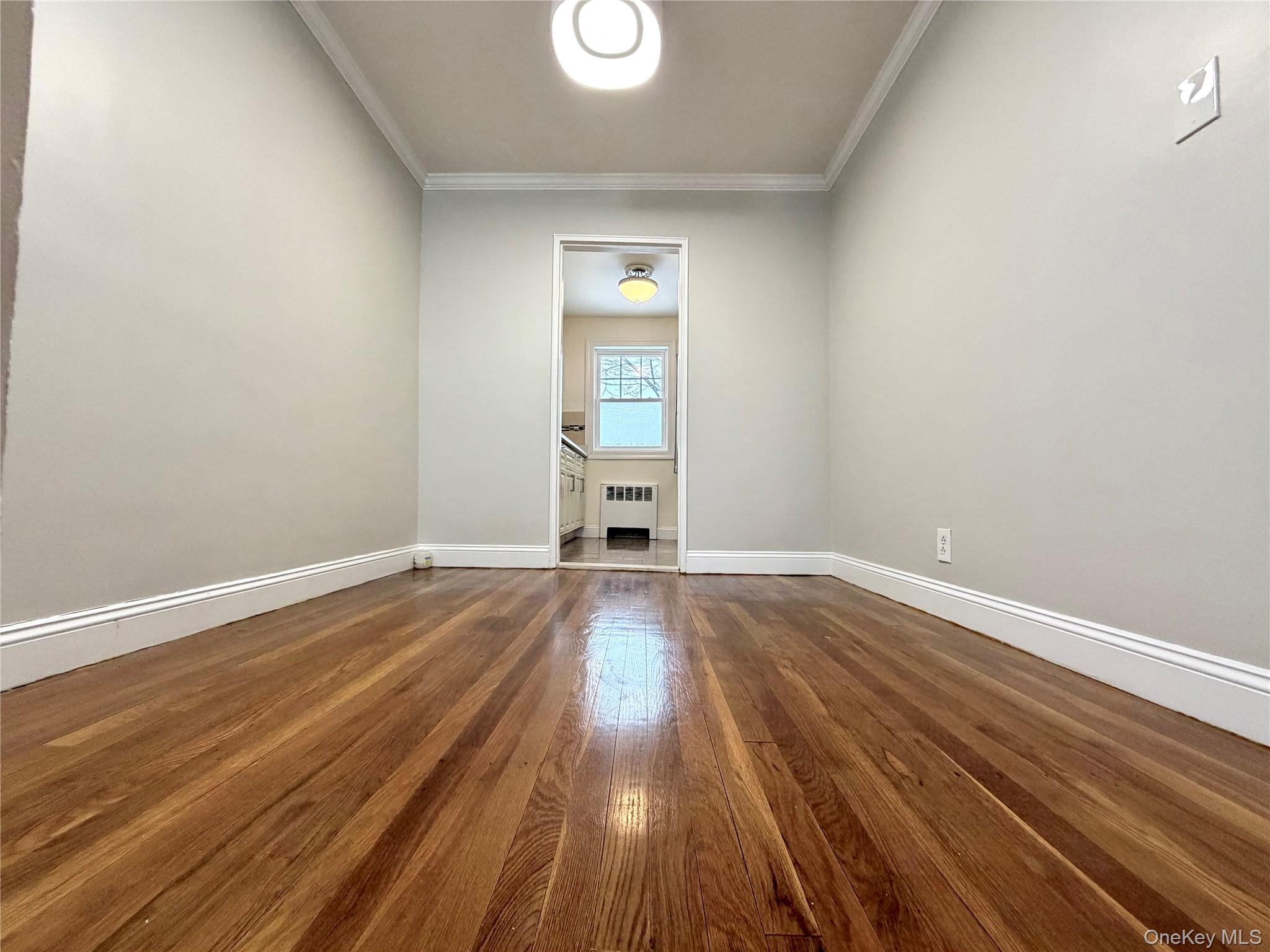 77-17 Springfield Boulevard, Unit 98 Queens, NY 11364 - Photo 6 of 18 a view of empty room with wooden floor