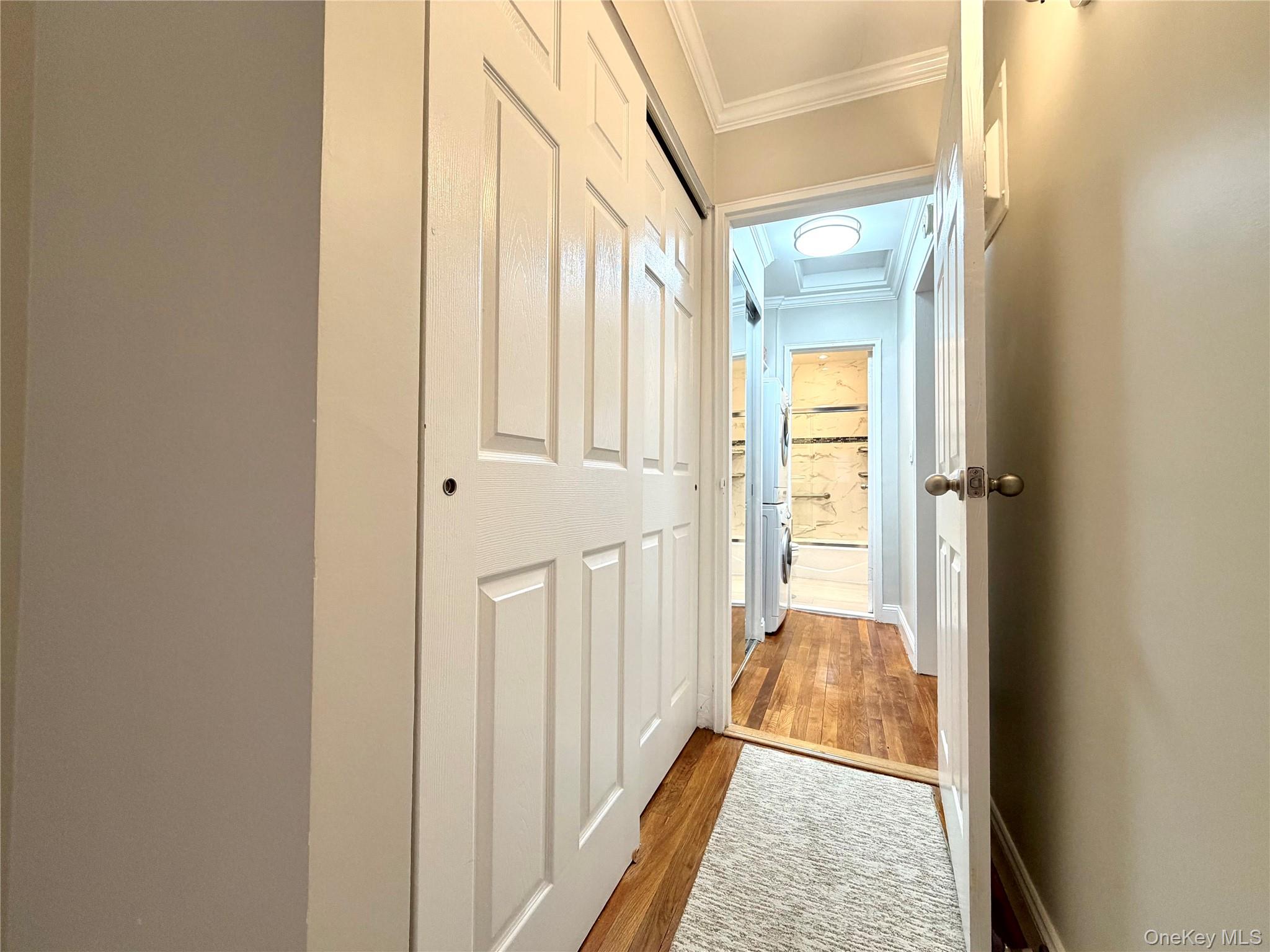 77-17 Springfield Boulevard, Unit 98 Queens, NY 11364 - Photo 8 of 18 a view of a hallway with a wooden floor