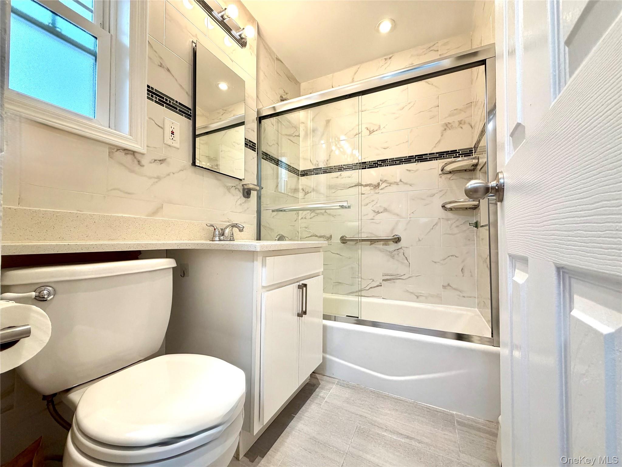 77-17 Springfield Boulevard, Unit 98 Queens, NY 11364 - Photo 9 of 18 a bathroom with a toilet and a shower