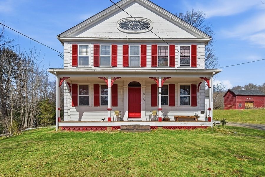 front view of a house with a yard