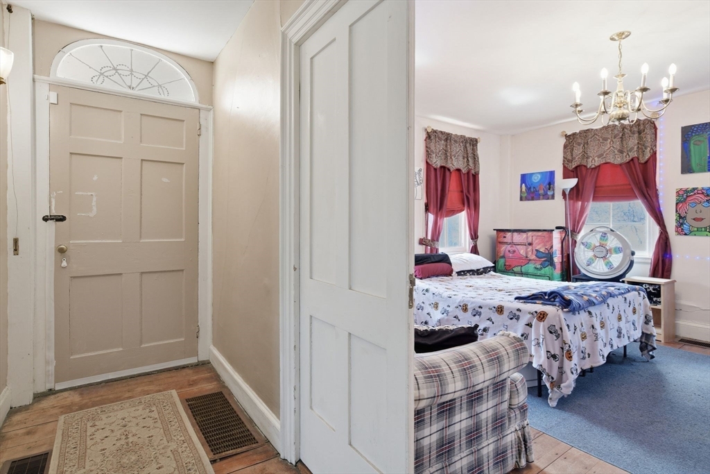 20 Depot Street Southwick, MA 01077 - Photo 12 of 36 a bedroom with bed and wooden floor