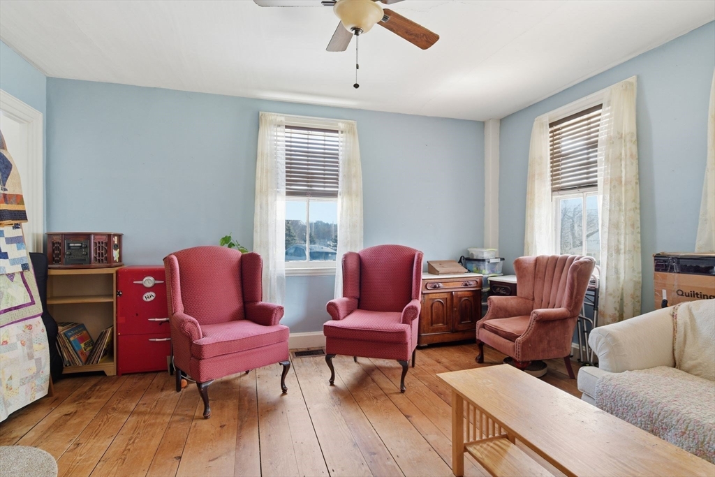 20 Depot Street Southwick, MA 01077 - Photo 13 of 36 a living room with furniture a fireplace and a window