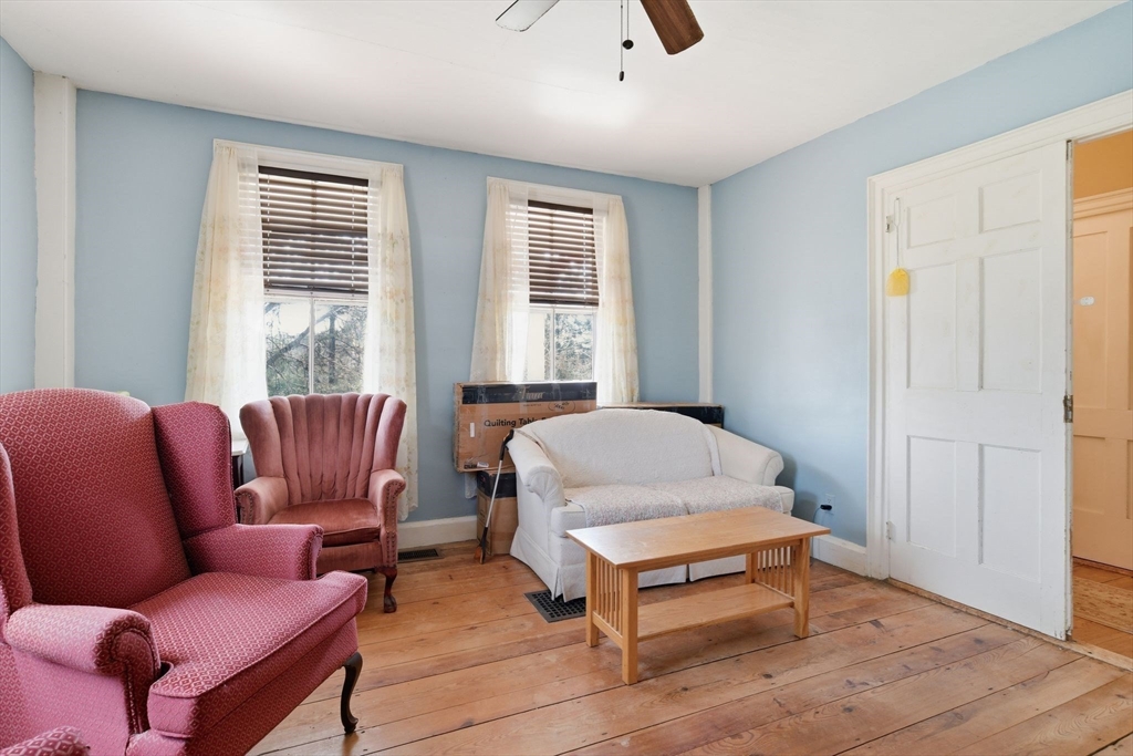 20 Depot Street Southwick, MA 01077 - Photo 15 of 36 a bedroom with a bed and wooden floor