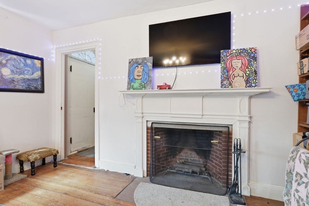 20 Depot Street Southwick, MA 01077 - Photo 17 of 36 a living room with furniture and a fireplace