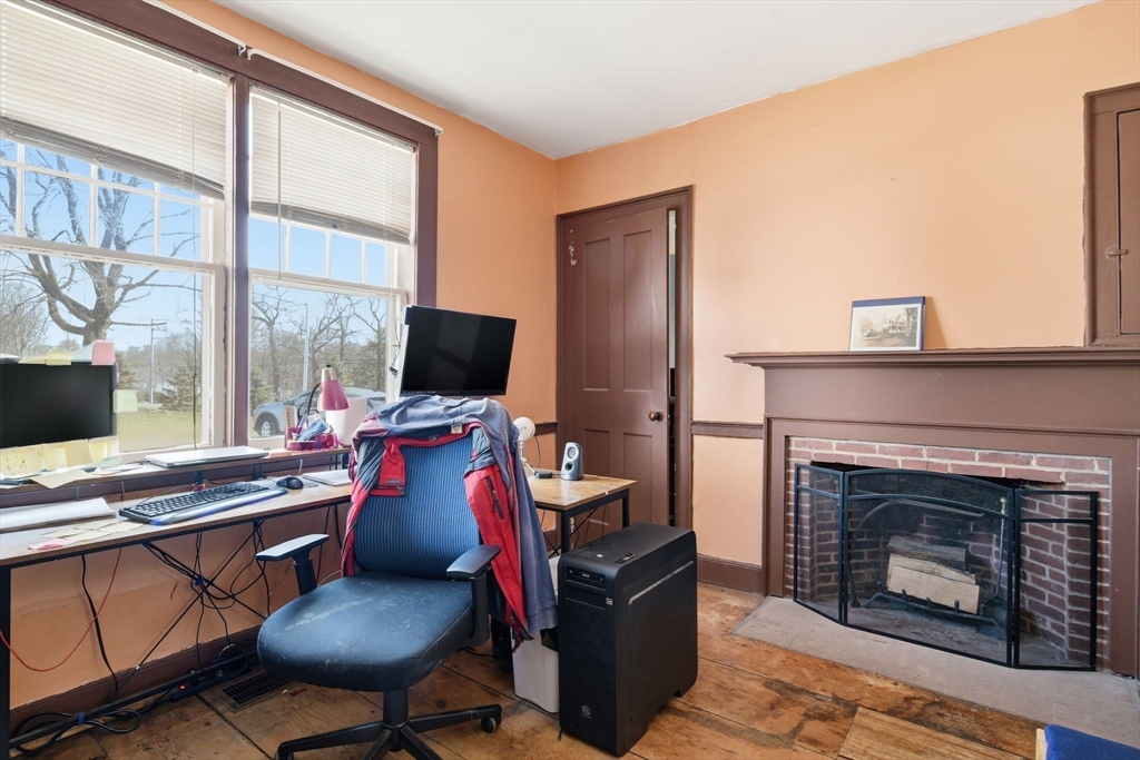 20 Depot Street Southwick, MA 01077 - Photo 20 of 36 a view of a workspace with furniture and a fireplace