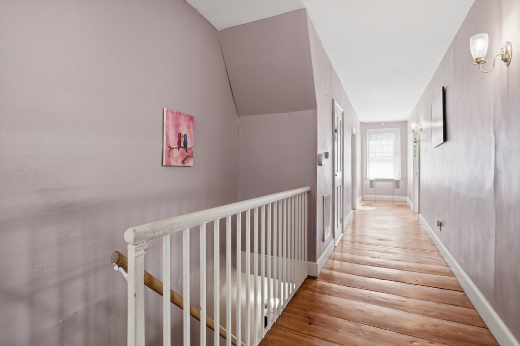 20 Depot Street Southwick, MA 01077 - Photo 21 of 36 a view of a hallway with wooden floor and stairs