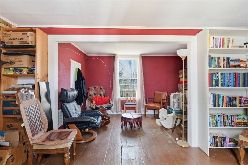 20 Depot Street Southwick, MA 01077 - Photo 25 of 36 a living room with furniture a bookshelf and a window