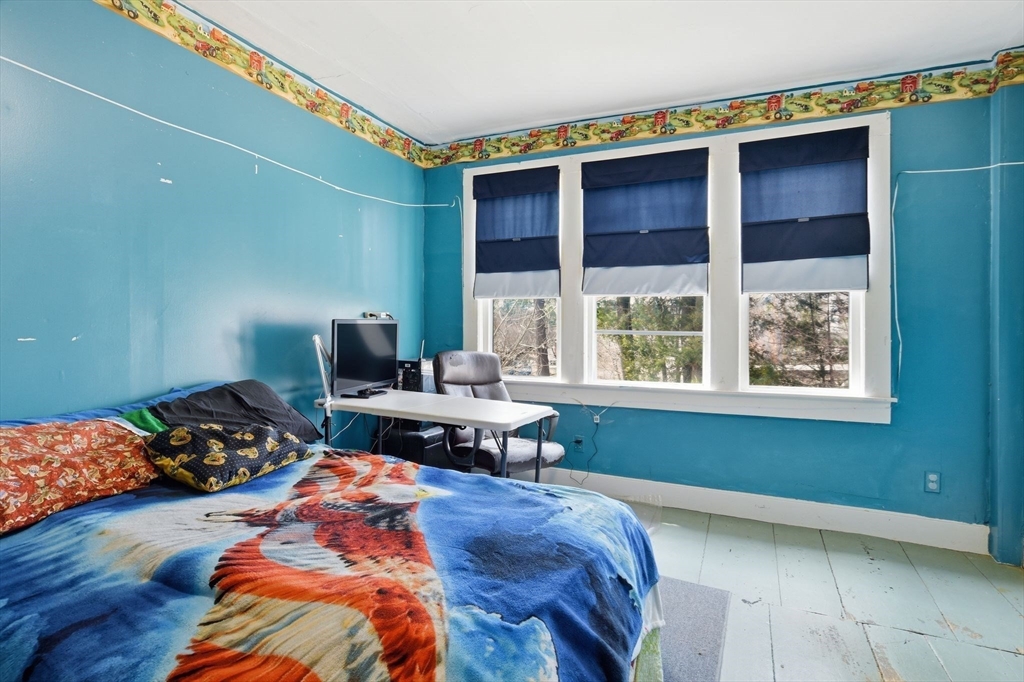 20 Depot Street Southwick, MA 01077 - Photo 27 of 36 a bedroom with a bed and a window