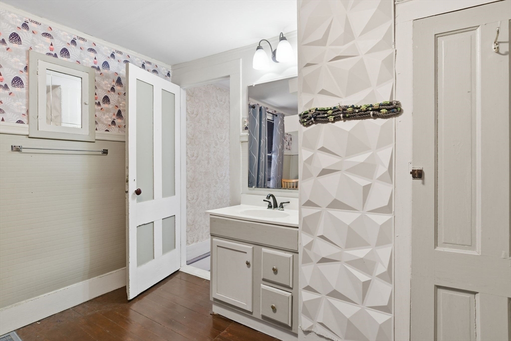 20 Depot Street Southwick, MA 01077 - Photo 29 of 36 a bathroom with a double vanity sink mirror and shower