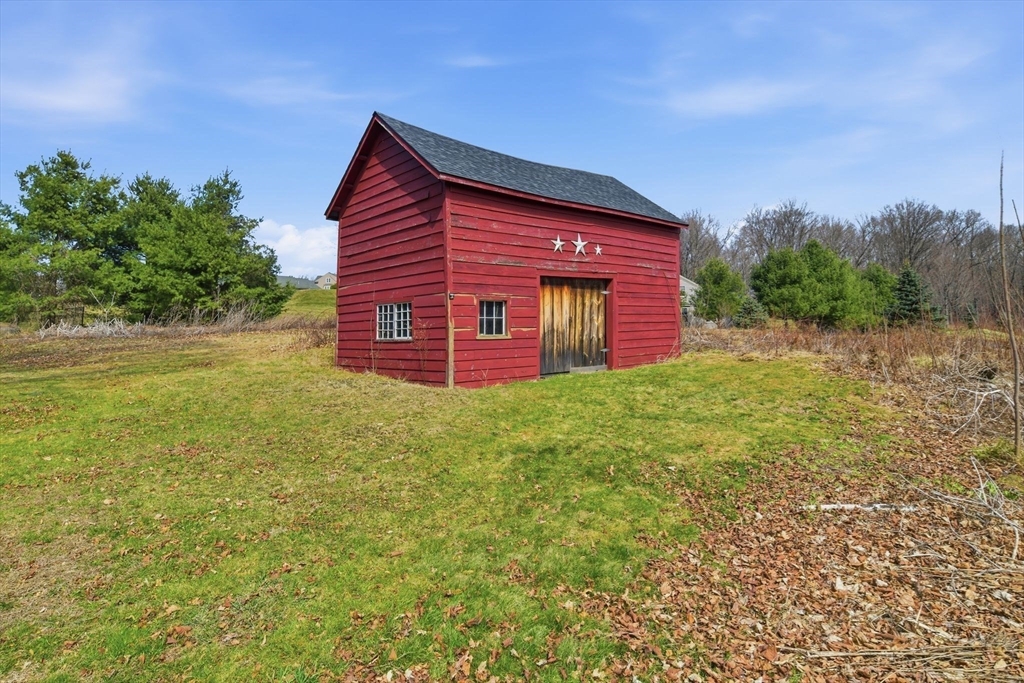 20 Depot Street Southwick, MA 01077 - Photo 33 of 36 a backyard of a house with lots of green space