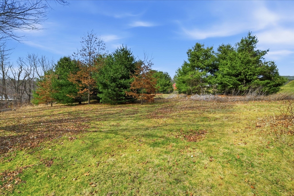 20 Depot Street Southwick, MA 01077 - Photo 34 of 36 a view of a yard with a house in the background