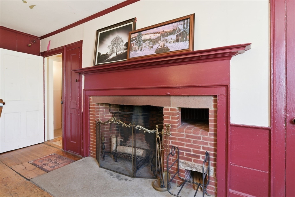 20 Depot Street Southwick, MA 01077 - Photo 6 of 36 a hallway with fireplace and baby