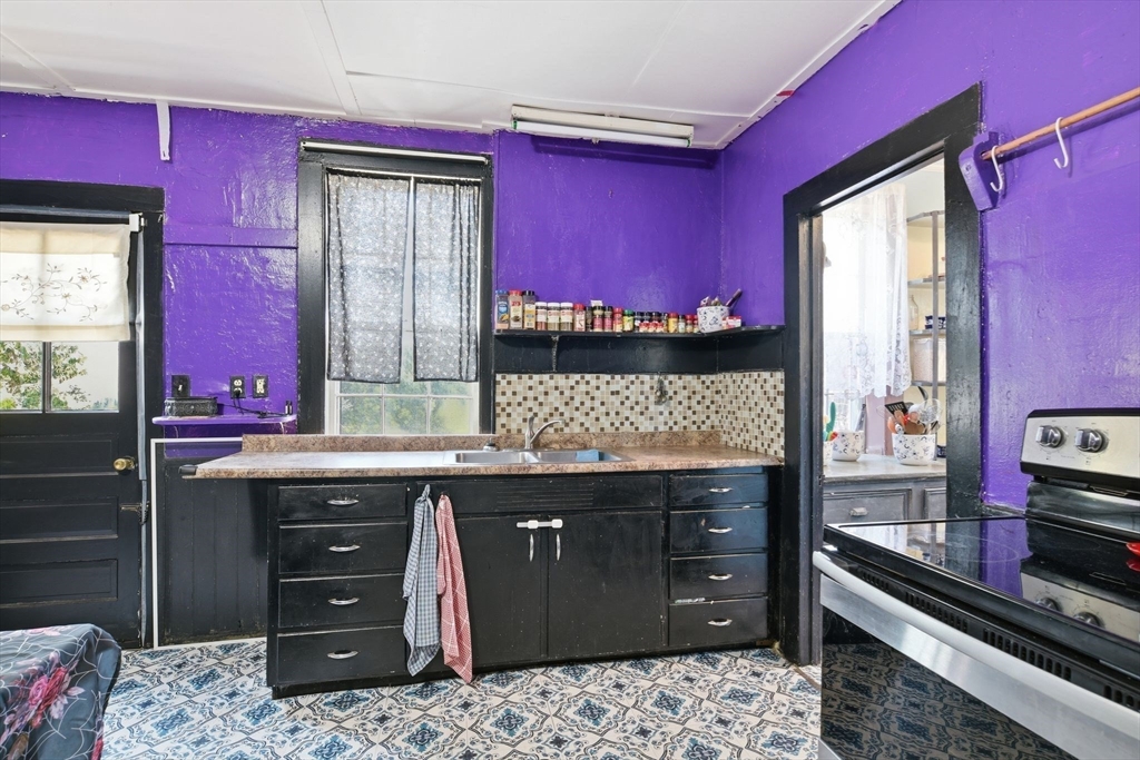 20 Depot Street Southwick, MA 01077 - Photo 8 of 36 a kitchen with a sink stove and cabinets