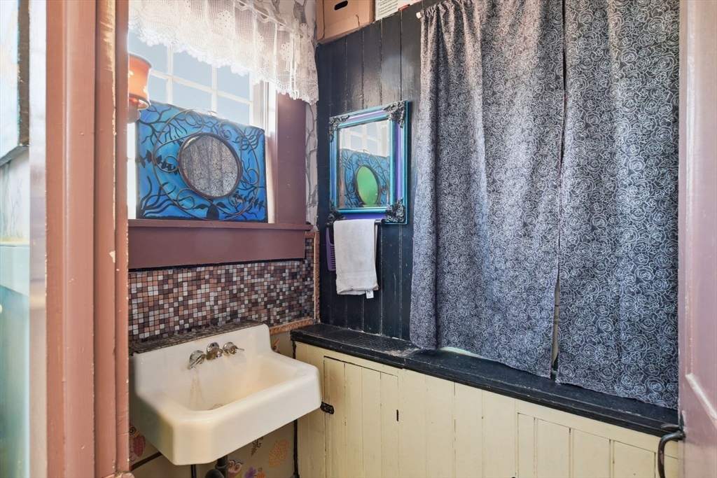 20 Depot Street Southwick, MA 01077 - Photo 10 of 36 a bathroom with a sink and a mirror