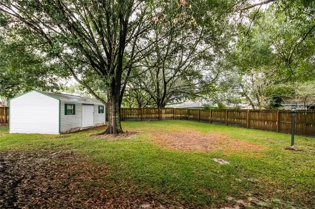 a swimming pool with wooden fence