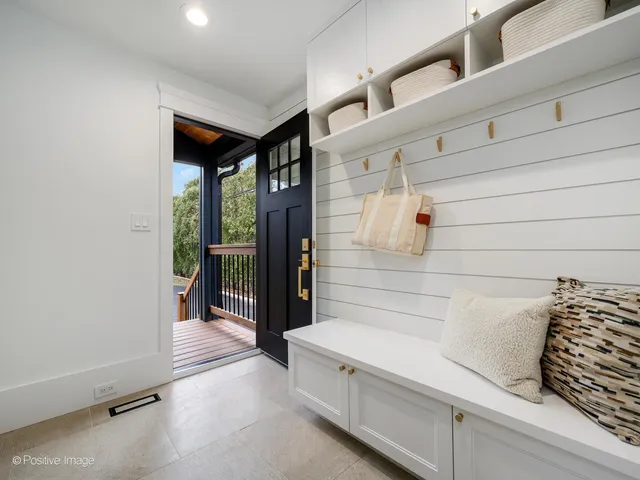 a view of a house with wooden deck