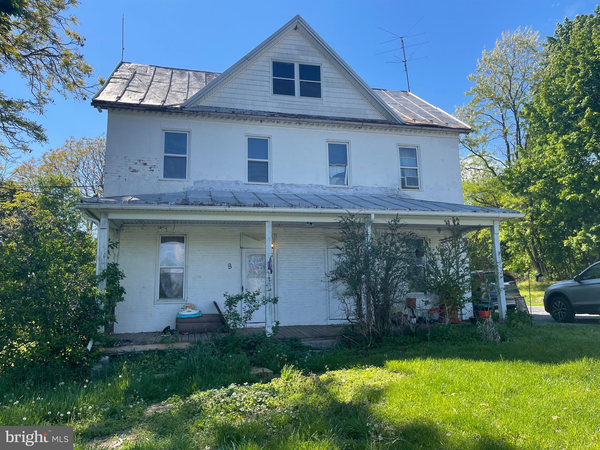 720 Littlestown Pike Westminster, MD 21157 - Photo 2 of 7 a front view of a house with a garden