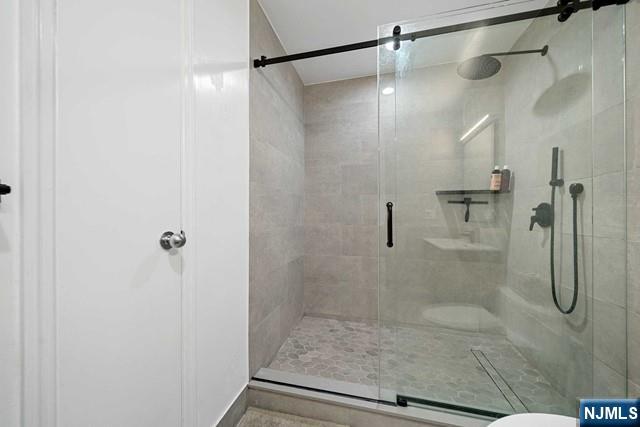 1225 River Road, Unit 6A Edgewater, NJ 07020 - Photo 26 of 30 a bathroom with a shower