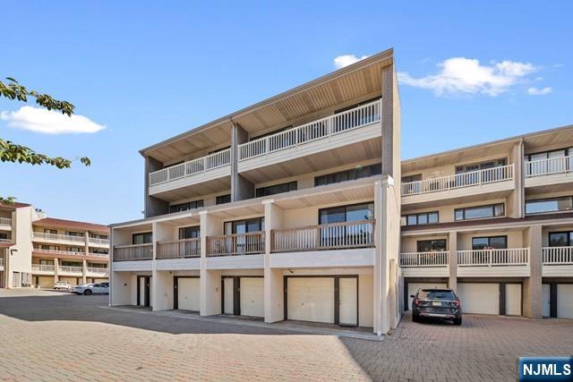 1225 River Road, Unit 6A Edgewater, NJ 07020 - Photo 28 of 30 a front view of a building with glass windows