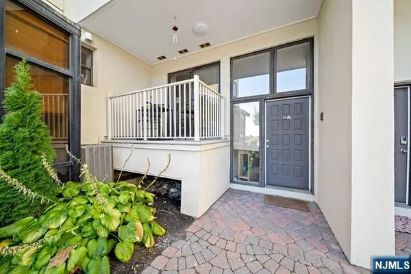 an entryway with a flower garden