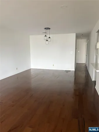 an empty room with a empty space and a ceiling fan