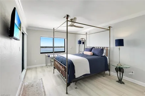 a bedroom with a bed and a mirror