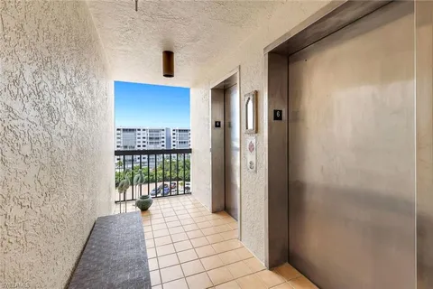 a view of a hallway with a outdoor space