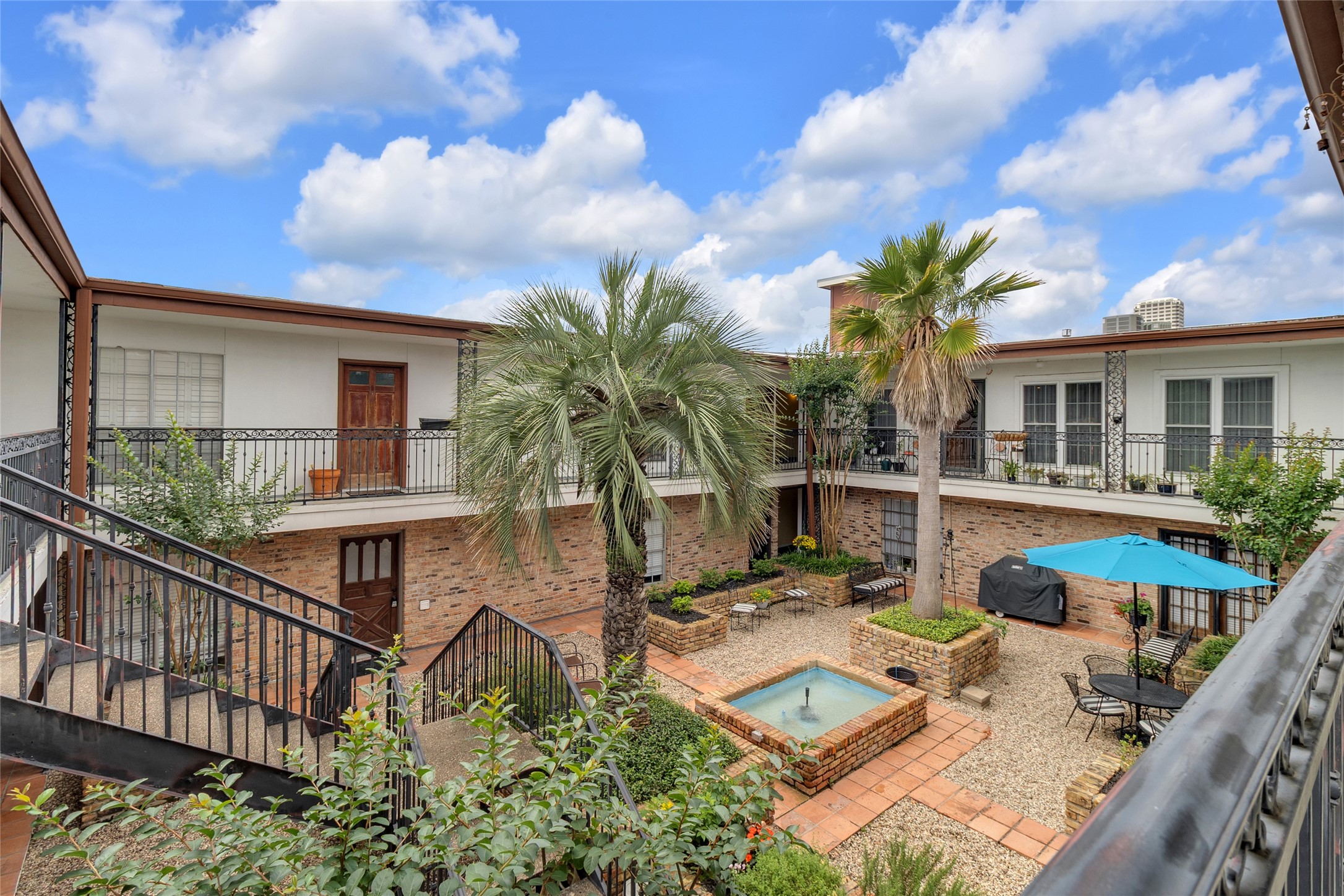 1909 Brun Street, Unit 17 Houston, TX 77019 - Photo 13 of 15 a view of a house with backyard and sitting area