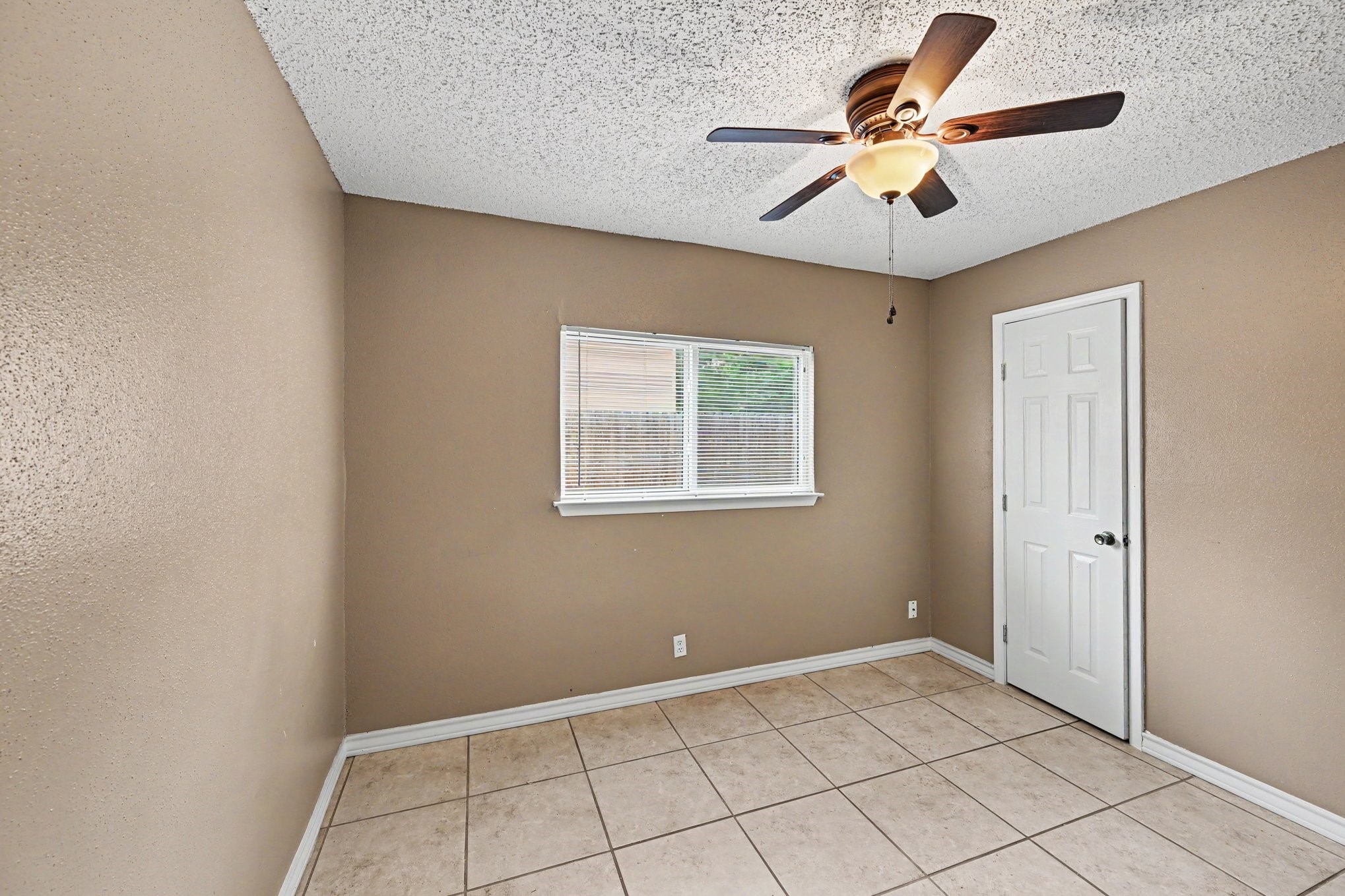 8406 Forest Ridge Drive San Antonio, TX 78239 - Photo 23 of 33 a view of an empty room with a window