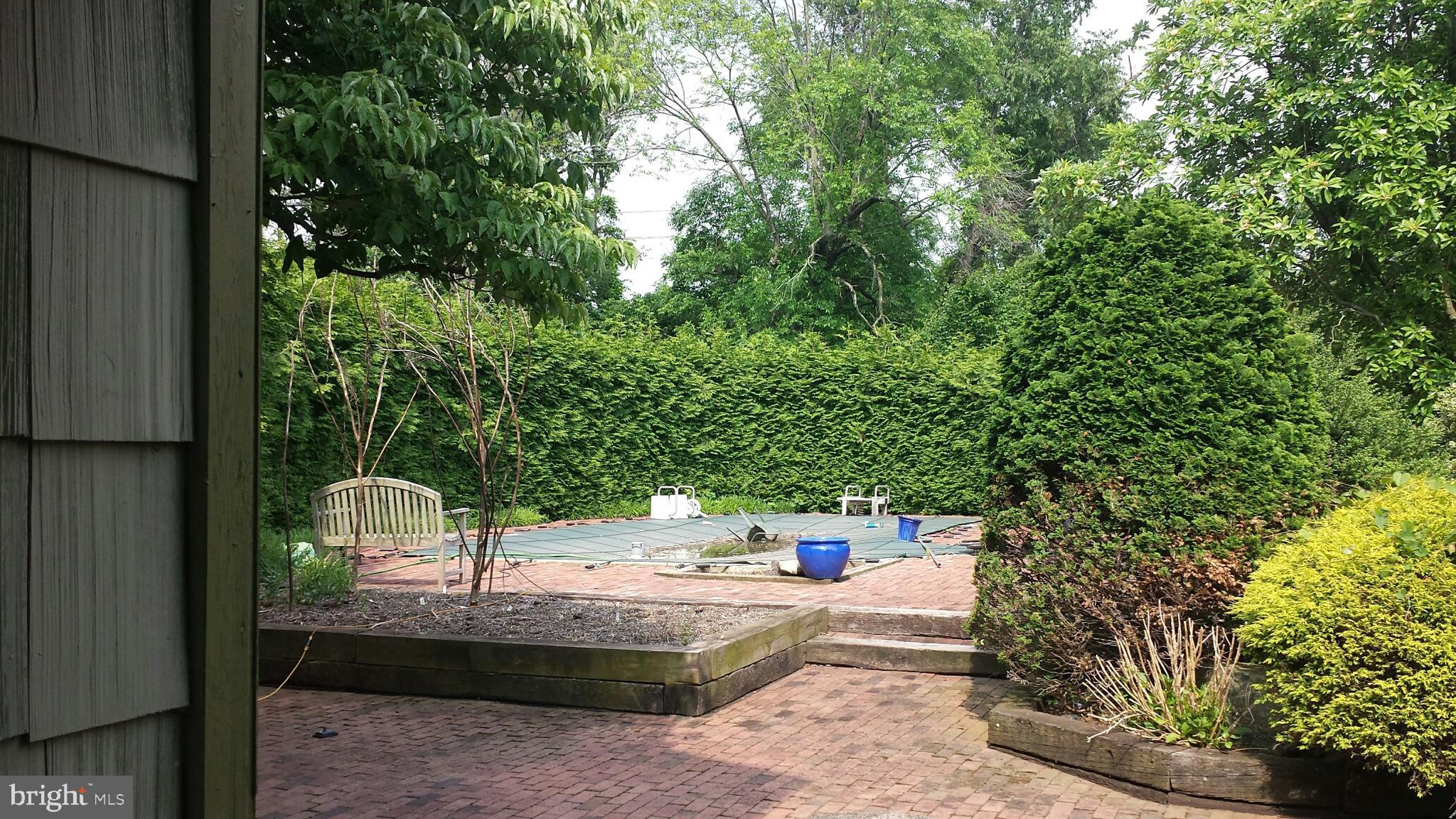 545 Weston Canal Road Somerset, NJ 08873 - Photo 15 of 41 a house view with a sitting space fire pit and large trees