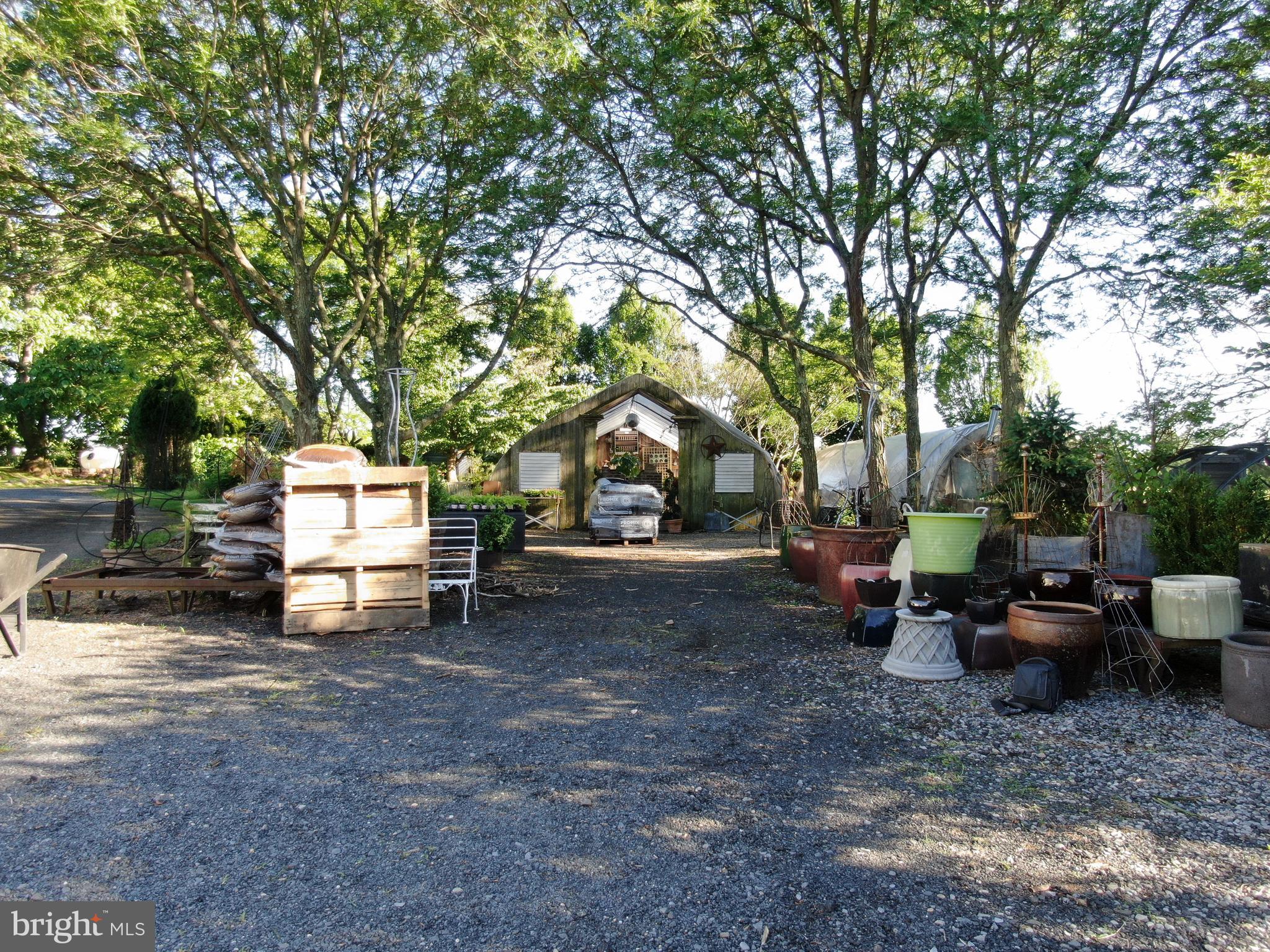 545 Weston Canal Road Somerset, NJ 08873 - Photo 25 of 41 a view of a park with large trees and wooden fence