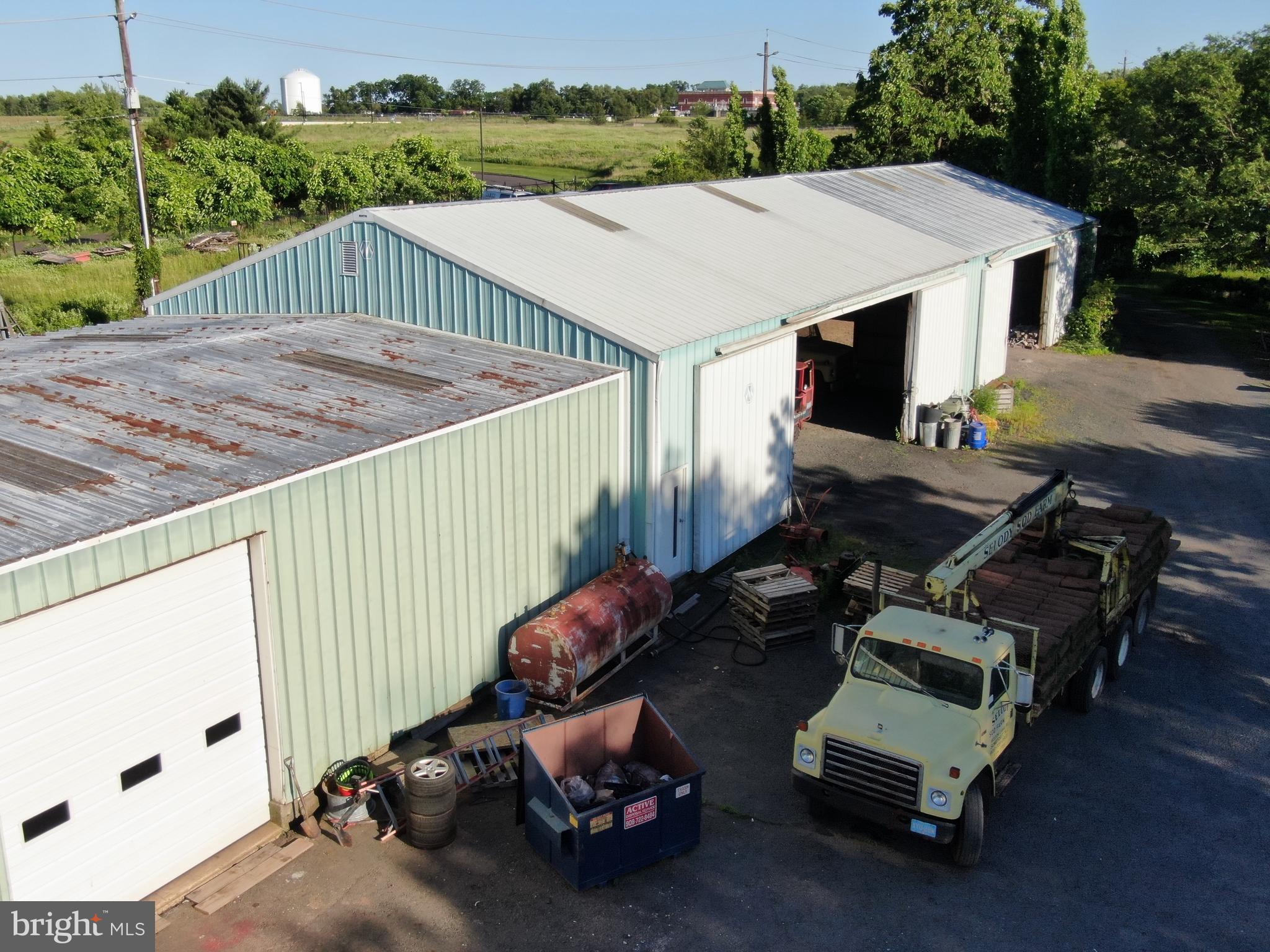 545 Weston Canal Road Somerset, NJ 08873 - Photo 30 of 41 a view of a patio with table and chairs with wooden floor and fence