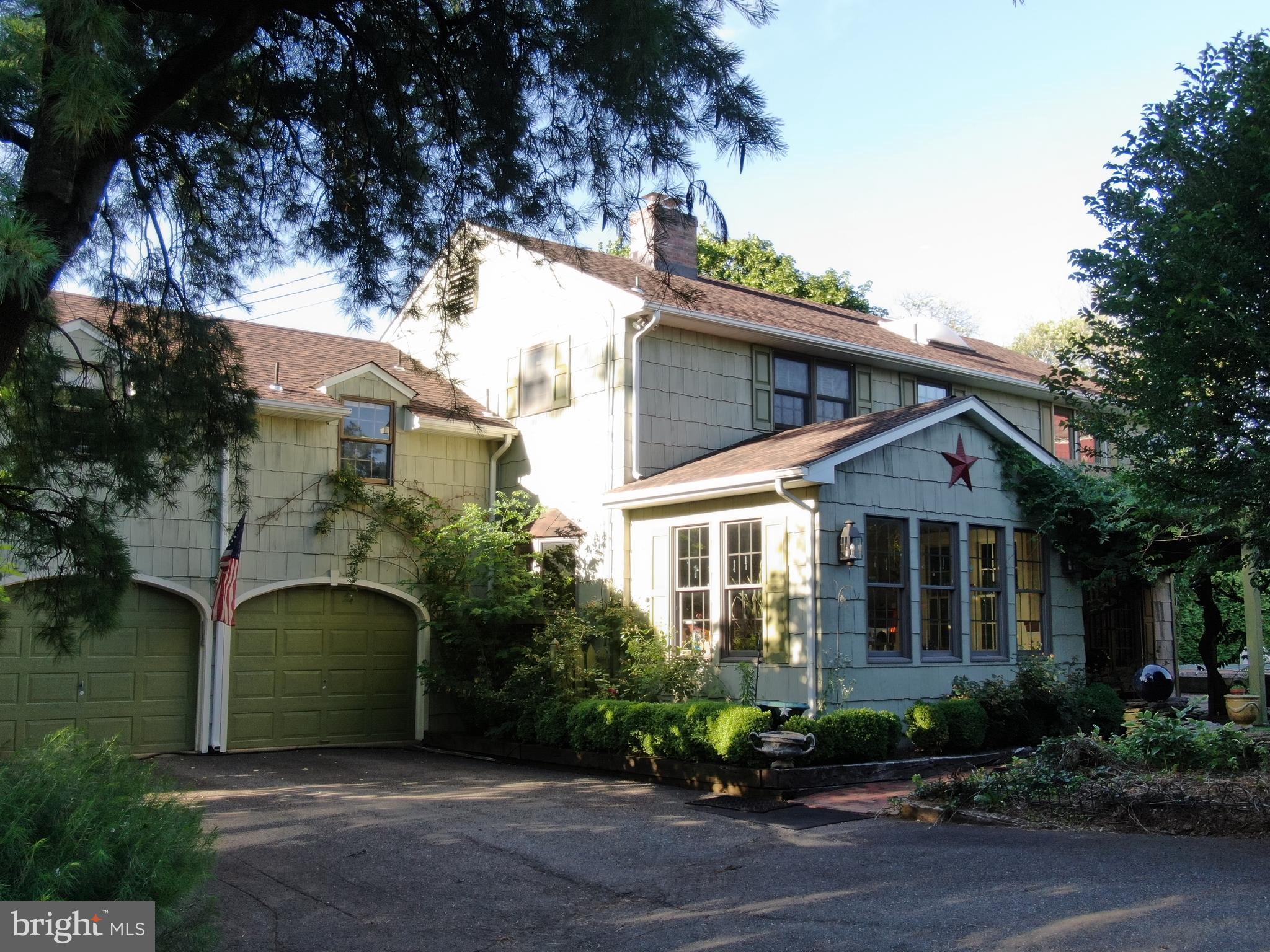 545 Weston Canal Road Somerset, NJ 08873 - Photo 31 of 41 a front view of a house with a garden