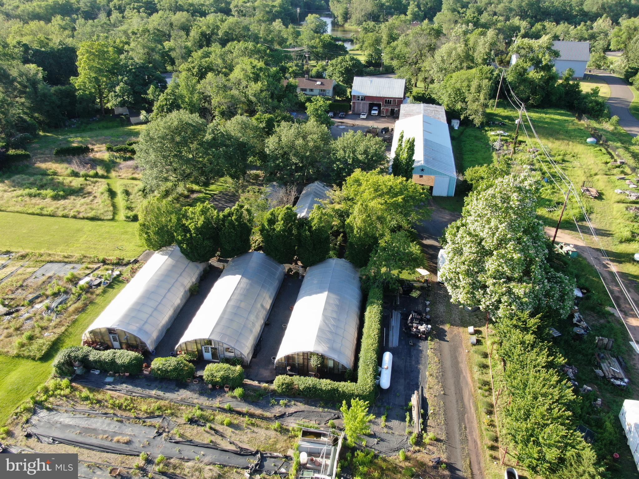 545 Weston Canal Road Somerset, NJ 08873 - Photo 35 of 41 an aerial view of a house with a yard and lake view in back