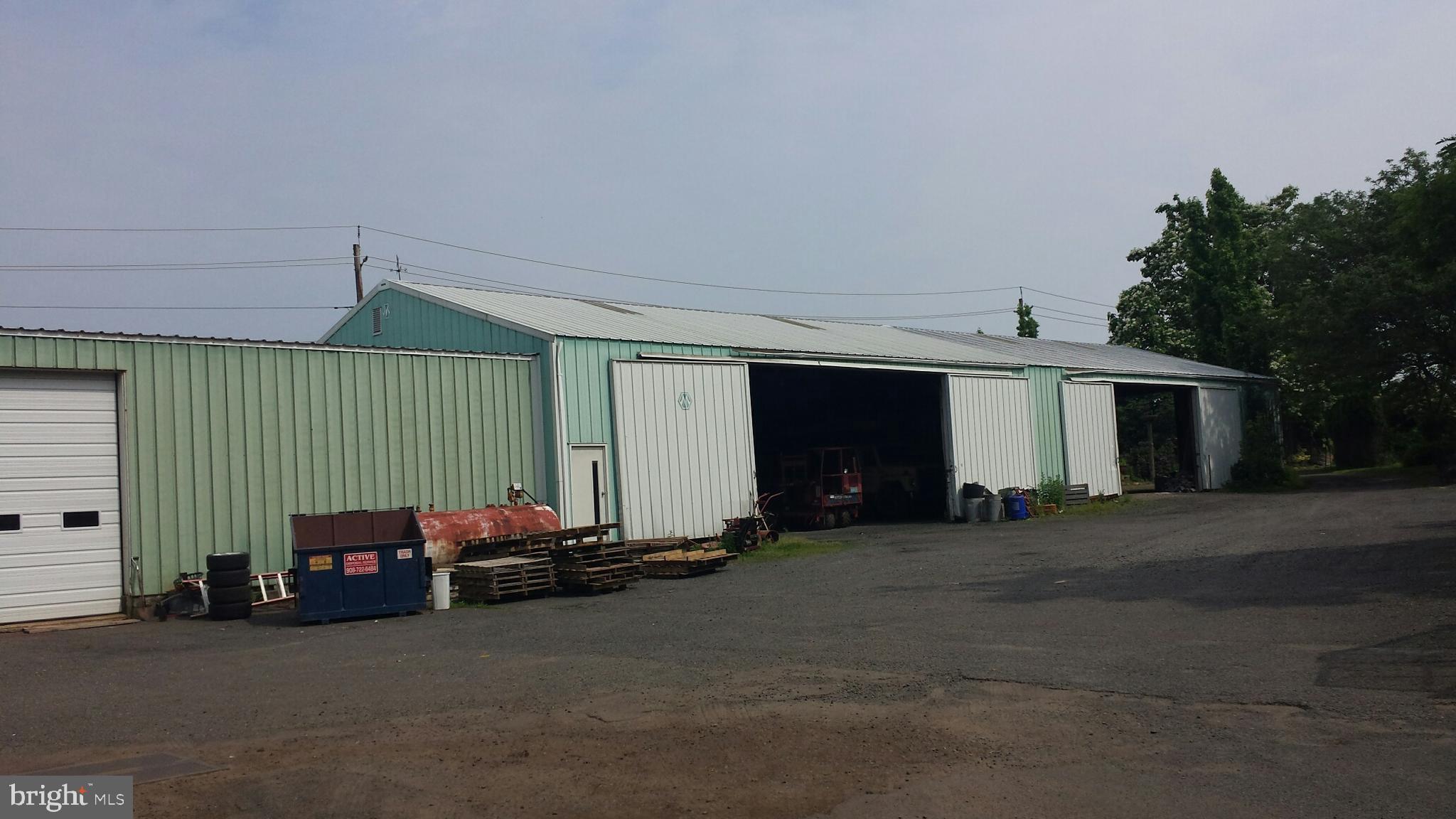545 Weston Canal Road Somerset, NJ 08873 - Photo 5 of 41 a couple of cars parked in front of garage