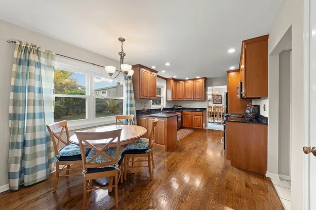 a kitchen with stainless steel appliances kitchen island granite countertop a sink and cabinets