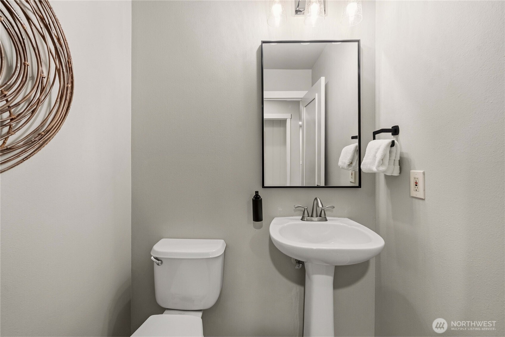 25010 235th Court Southeast Maple Valley, WA 98038 - Photo 22 of 40 a bathroom with a toilet a sink and a mirror