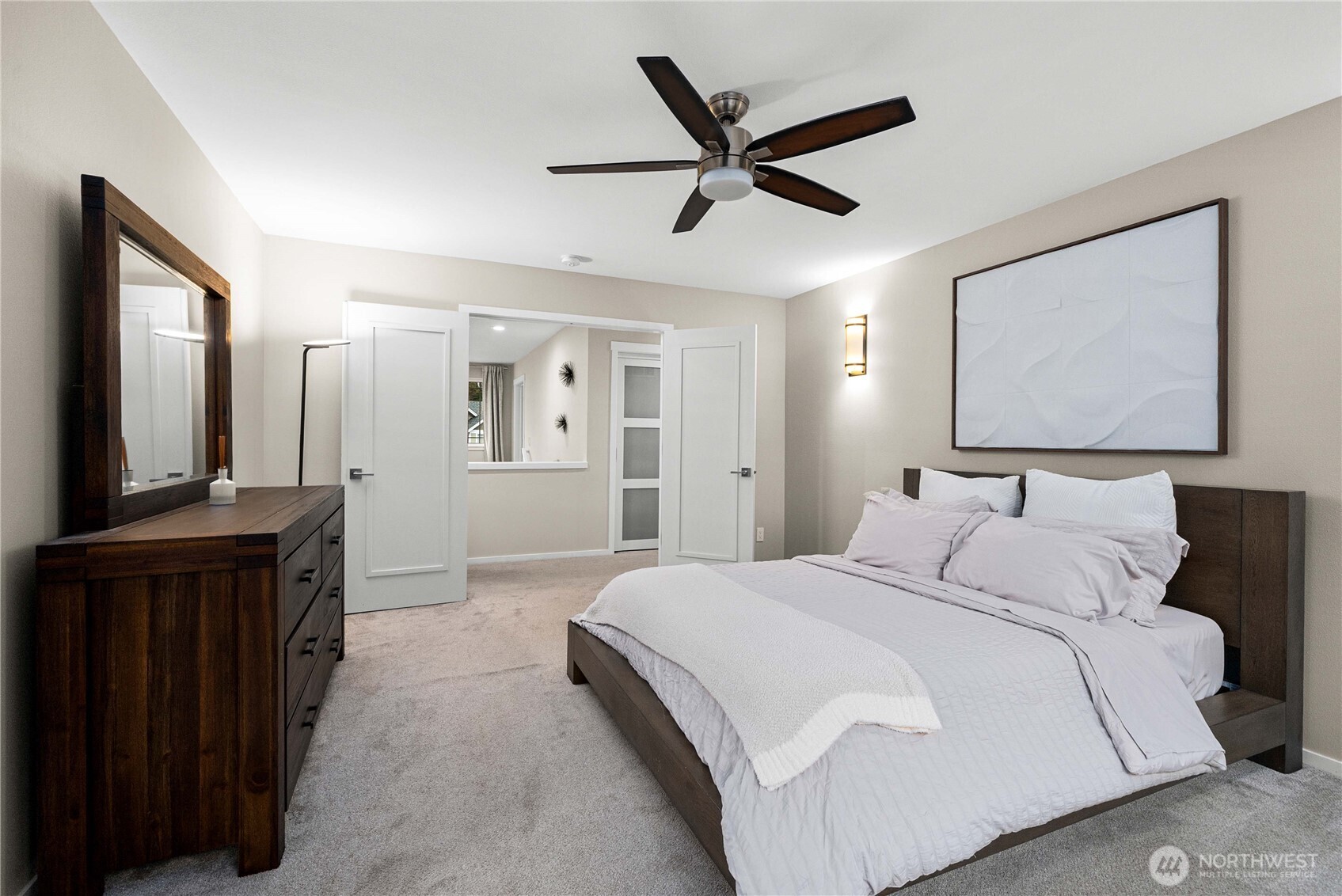 25010 235th Court Southeast Maple Valley, WA 98038 - Photo 27 of 40 a spacious bedroom with a bed and a mirror