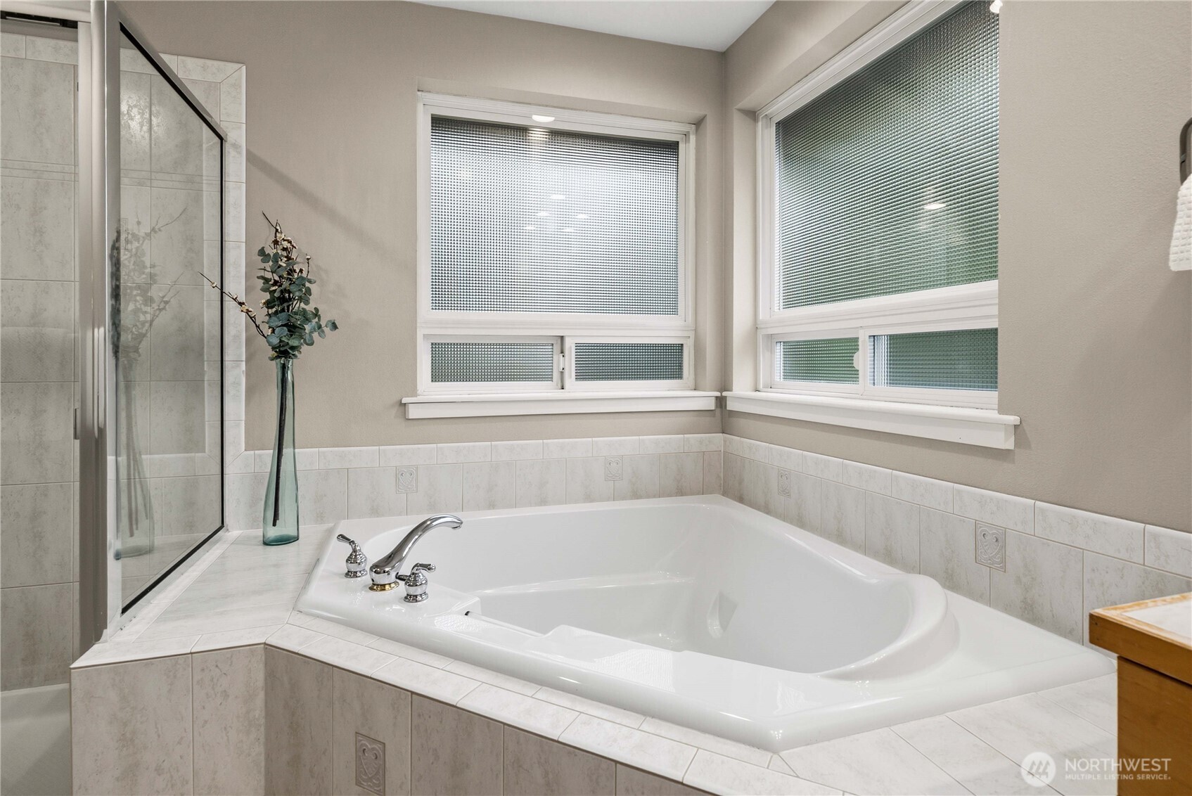 25010 235th Court Southeast Maple Valley, WA 98038 - Photo 30 of 40 a white bath tub sitting next to a window