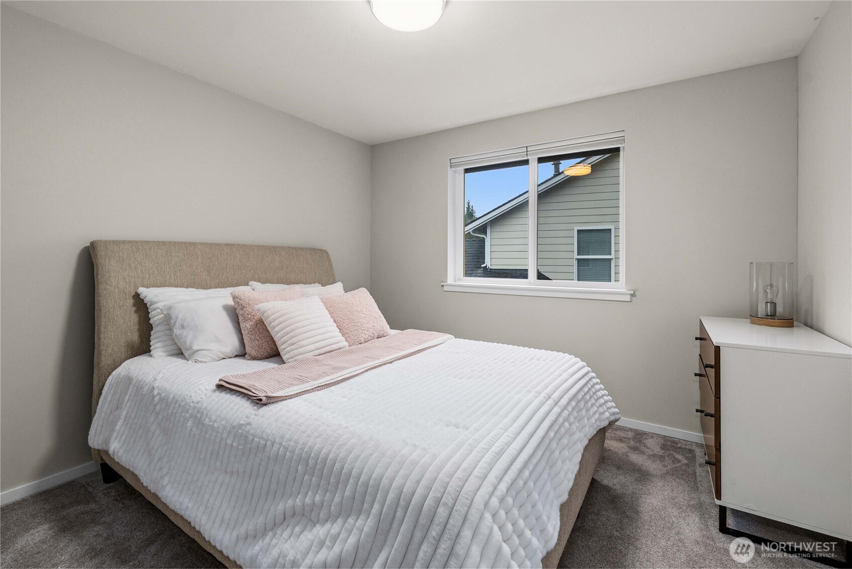 25010 235th Court Southeast Maple Valley, WA 98038 - Photo 31 of 40 a bedroom with a bed and a window
