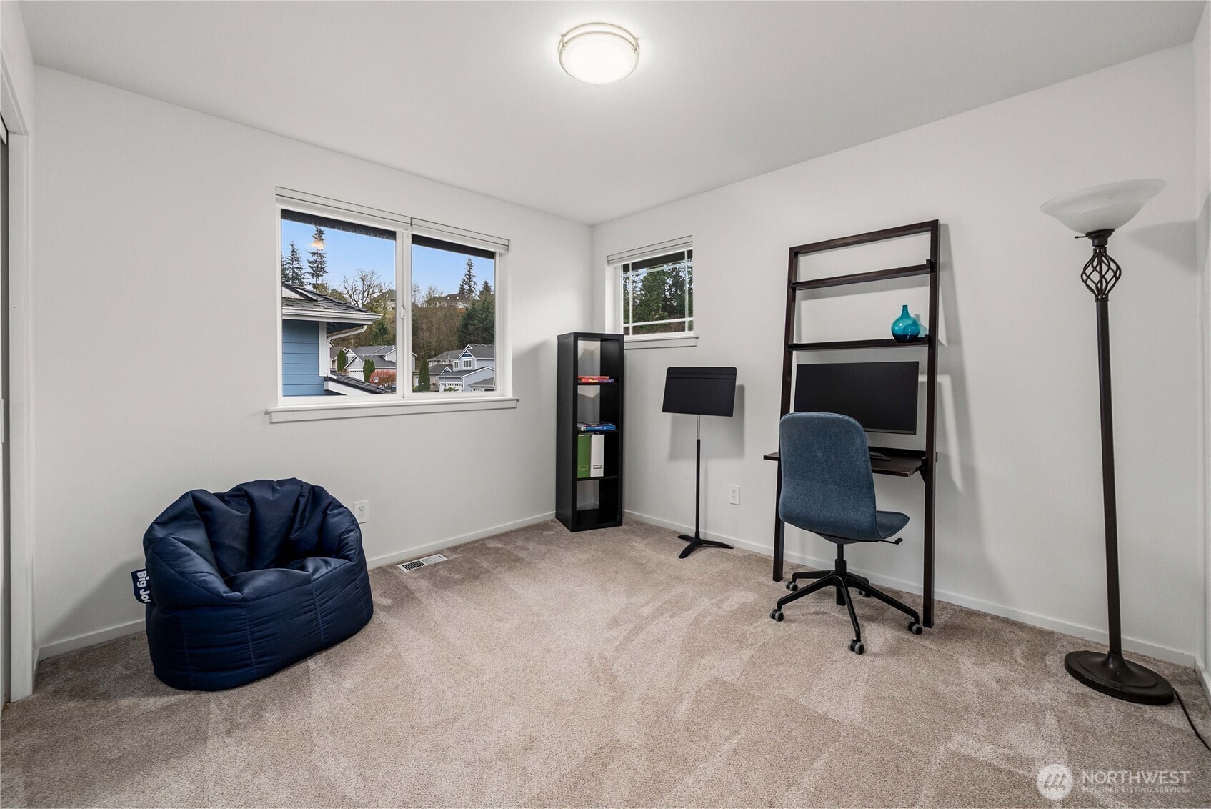 25010 235th Court Southeast Maple Valley, WA 98038 - Photo 33 of 40 a workspace with a couch and a window