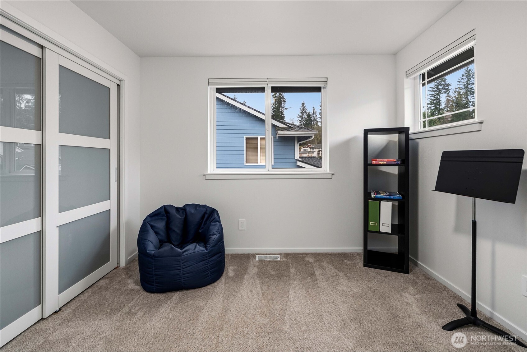 25010 235th Court Southeast Maple Valley, WA 98038 - Photo 34 of 40 a room with a window and a painting on the wall