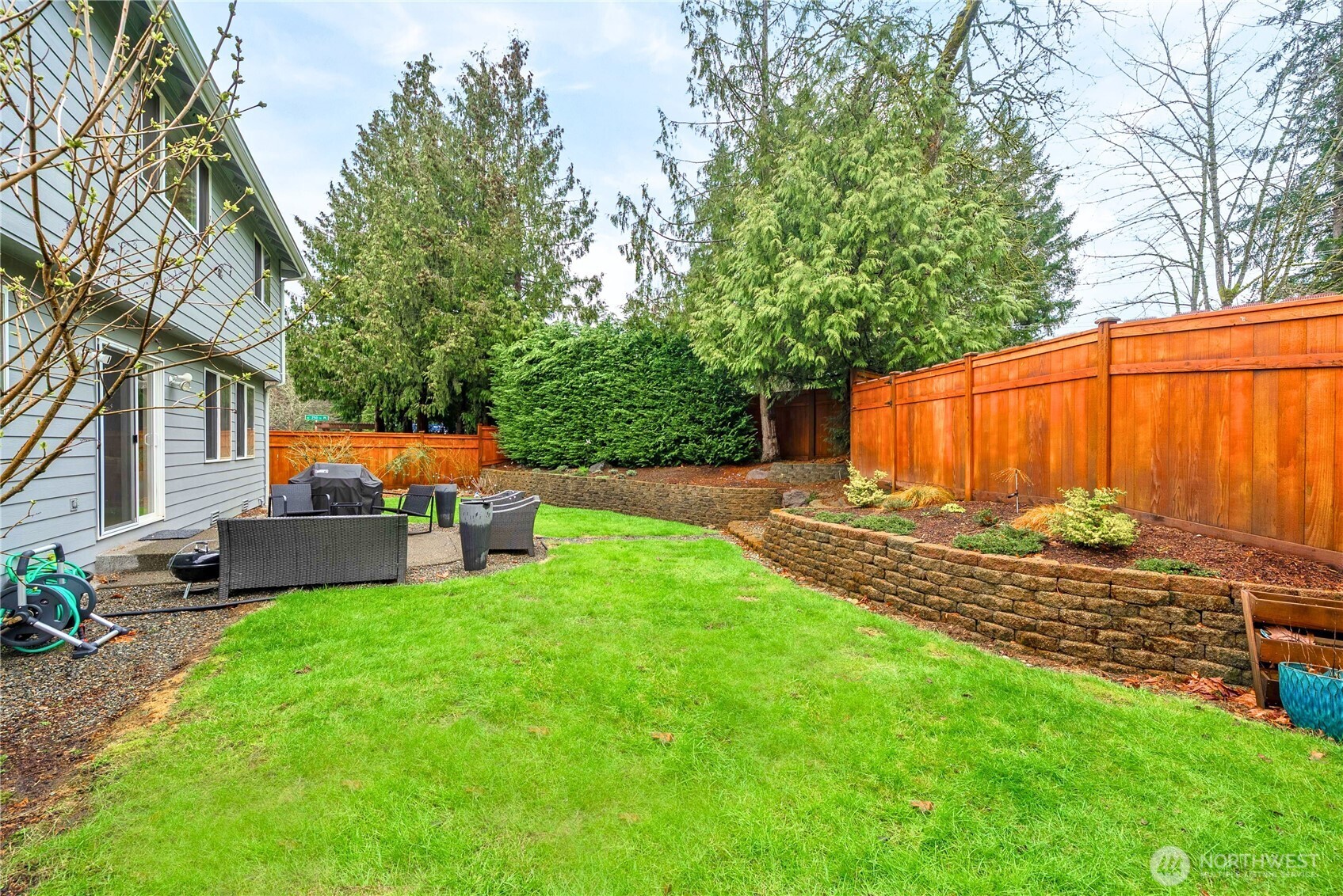 25010 235th Court Southeast Maple Valley, WA 98038 - Photo 38 of 40 a view of a house with backyard and sitting area